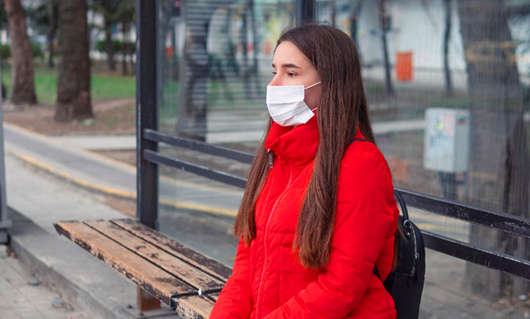 1611299851118552.jpg woman-wearing-surgical-mask-bus-stop.jpg